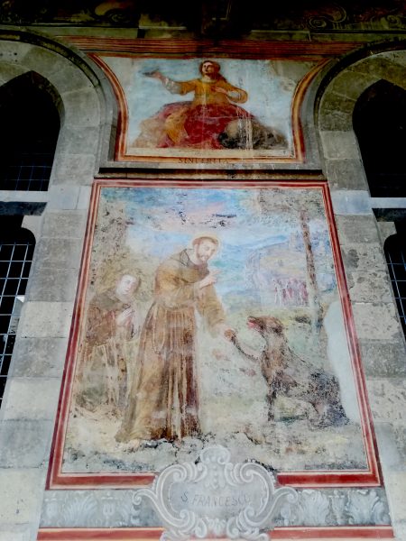 Francesco e il lupo. Affresco seicentesco dal chiostro del monastero di santa Chiara a Napoli